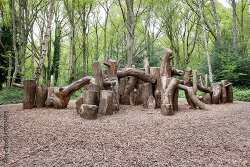 Natural woodland play area made with sustainably felled oak tree trunks on Chorleywood Common, Hertfordshire, England, UK