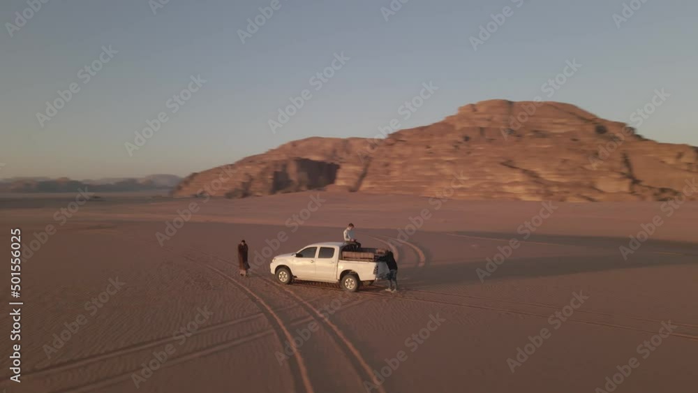 Pickup truck parked in between the Wadi Rum desert at Jordan Pickup truck parked in between the Wadi Rum desert at Jordan