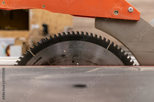 Industrial circular saw and vertical cutter in workshop. Woodworking equipment