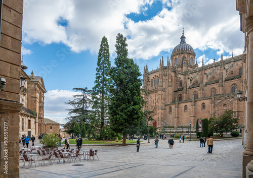 Salamanca, Spain - november 6 2022 - tourists and locals visiting the aquare in front of the Catedral de Salamanca photo