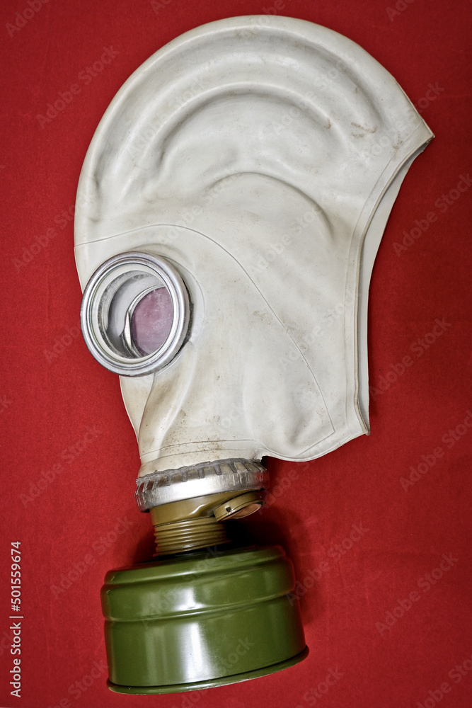 An old soviet gas mask lies on a red cloth Stock-Foto | Adobe Stock