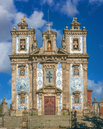 Porto, Portugal - november 9 2022 - people passing the Chruch of Saint Ildefonsus.(Igreja Paroquial de Santo Ildefonso) photo