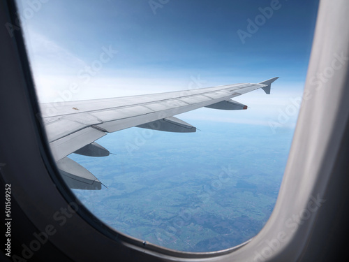 Airplane wing. View from plane window. Travel and transport concept