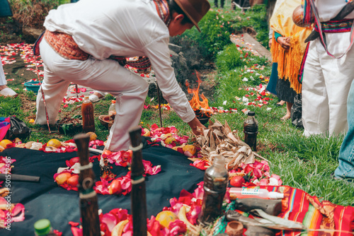 Ritual andino del Tumarina que se celebra durante la época del Pawkar Raymi o Celebración del florecimiento en la comunidad de Peguche, Ecuador. photo