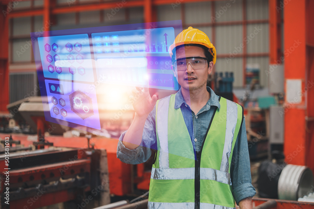 Worker using technology visual screen checking system safety before working in production factory Worker using technology visual screen checking system safety before working in production factory