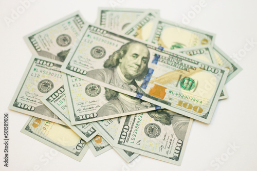 Stacks of paper 100 dollars USA on the white background