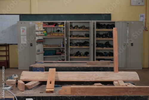 Senior male woodworker making console table  in workshop. Joinery work on the production  of wooden furniture. Small Business Concept