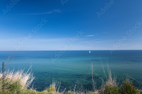 Landscape of blue Baltic sea with white sand and sky in north Germany