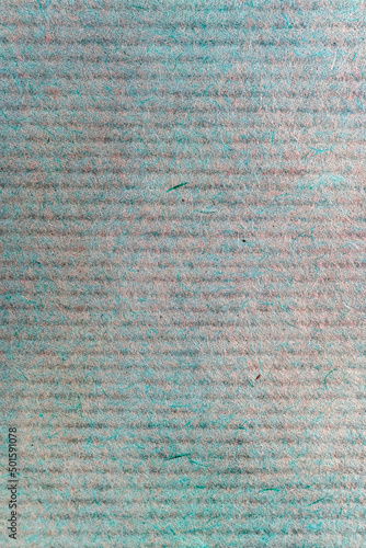 A sheet of green and brown paper close-up, macro paper fibers, background with horizontal stripes