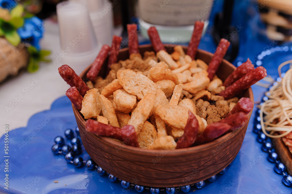 Slicing different types of meat. Meat snacks on the table. wedding
