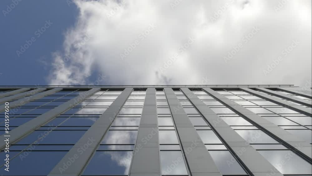 Exterior of a high-rise apartment building facade, windows and balconies. Exterior of a high-rise apartment building facade, windows and balconies.