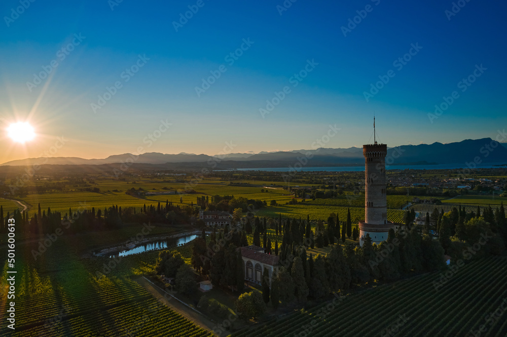 Tower of San Martino della Battaglia, Italy. Sunset. Vineyards of Italy on Lake Garda Italy.  Low sun. Celebration of the Italian Risorgimento. Aerial view of Lake Garda