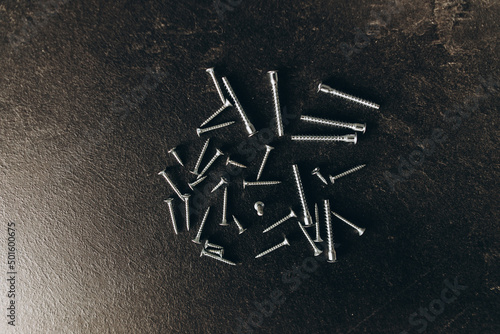 Sharp screws on a black background