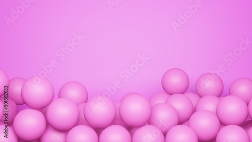 Pink spheres lie one on top of the other on a pink background. The place for the text is at the top. © Mikalai