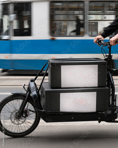 black cargo courier bike with two boxes close-up and space for logo photo