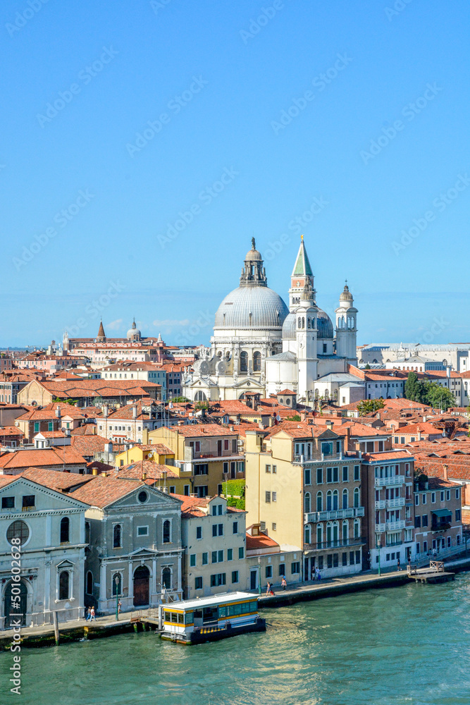 View of the Chiesa dello Spirito Santo and Scuola in the background of the Basilica Santa Maria della Salute and the Campanario bell tower in Venice, Italy.