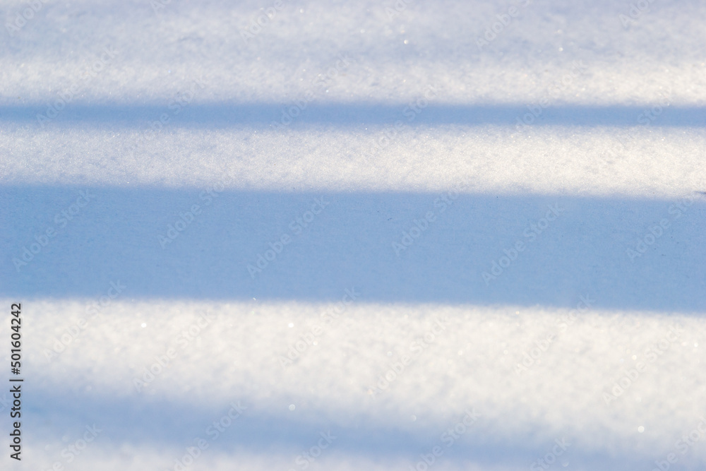 Obraz premium Horizontal blue shadows on snow