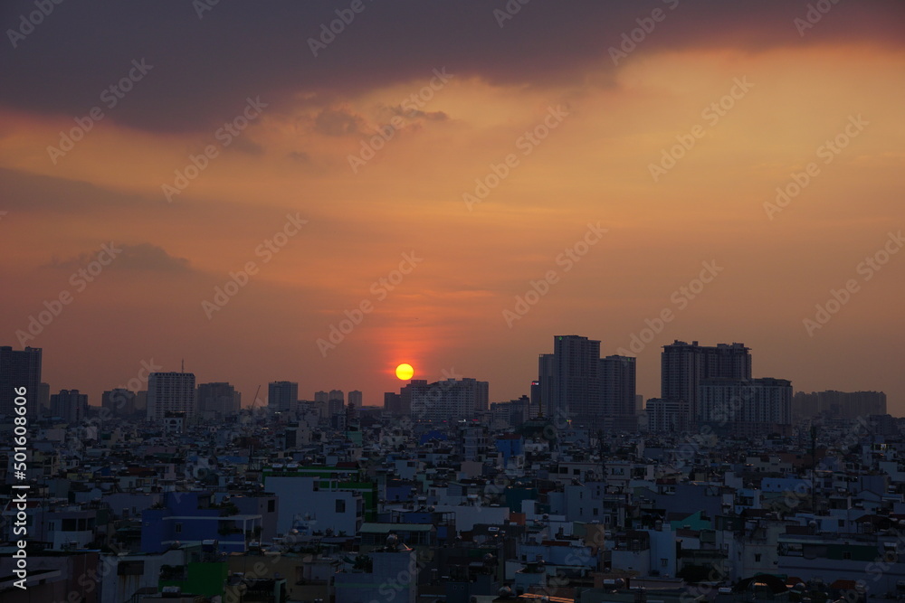 Golden sunset down behind Ho Chi Minh City Skyline, Vietnam