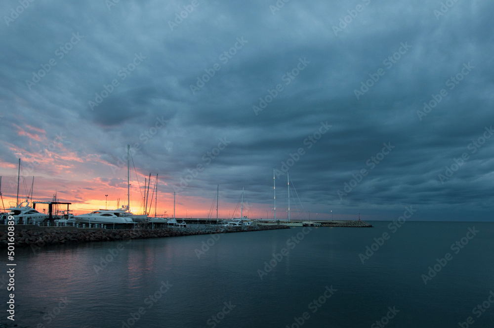 sunset over the harbor in uruguay