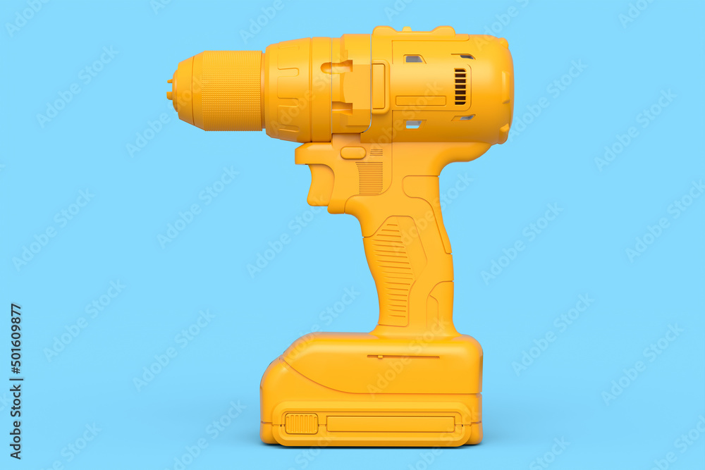 Cordless drill or screwdriver isolated on blue monochrome background Cordless drill or screwdriver isolated on blue monochrome background