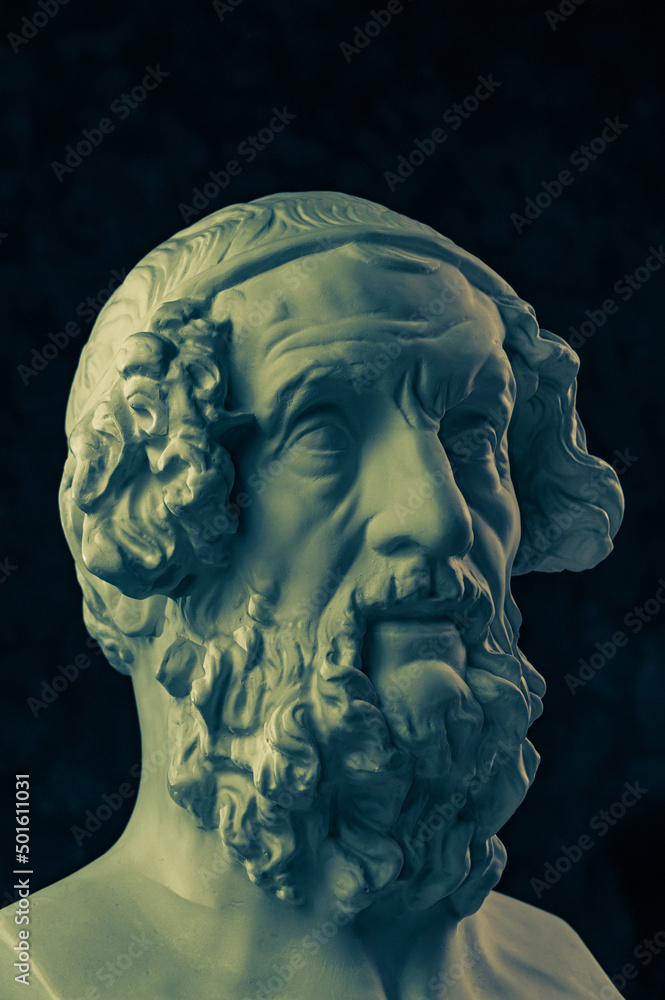 Bronze color gypsum copy of ancient statue Homer head for artists. Plaster antique sculpture of human face. Ancient greek poet and philosopher Homer is the legendary author of poems Iliad and Odyssey.