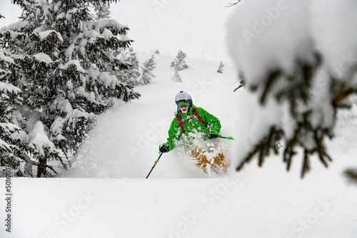 Alpine freeride skier skiing downhill with powder snow explosion. © fesenko