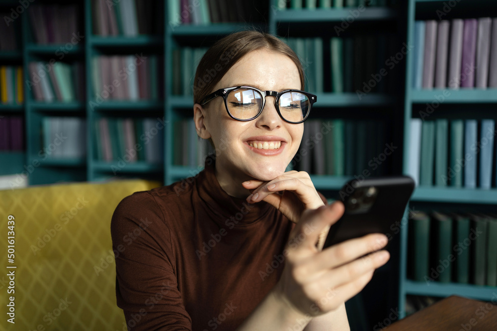 Woman with glasses message on the phone Woman with glasses message on the phone