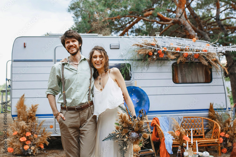 a young couple travels in a camper. enjoy each other and rest in a motorhome. love in motorhomes