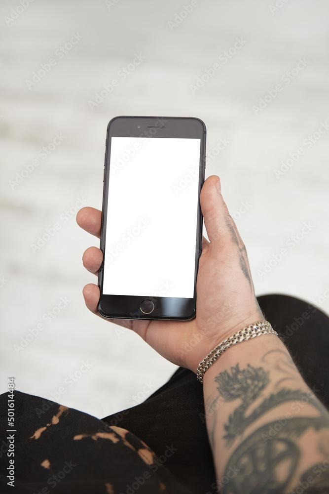 Man holding phone in hands on table white background isolated