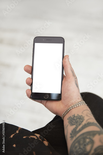 Man holding phone in hands on table white background isolated