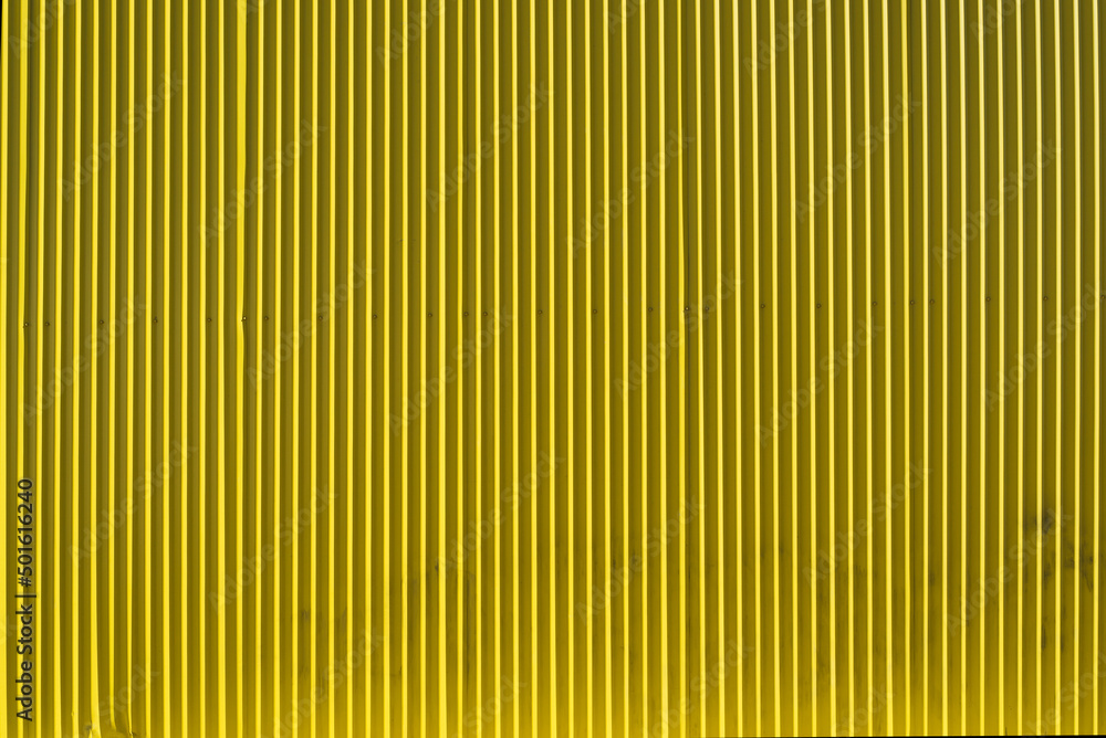 Obraz premium bright yellow corrugated metal wall textured background