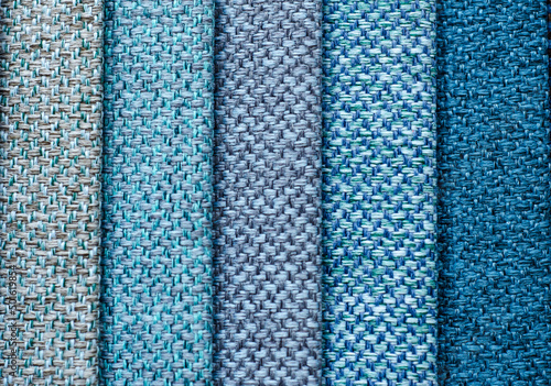 set of multi-colored dense fabrics of uniform texture. choice of materials in different colors.