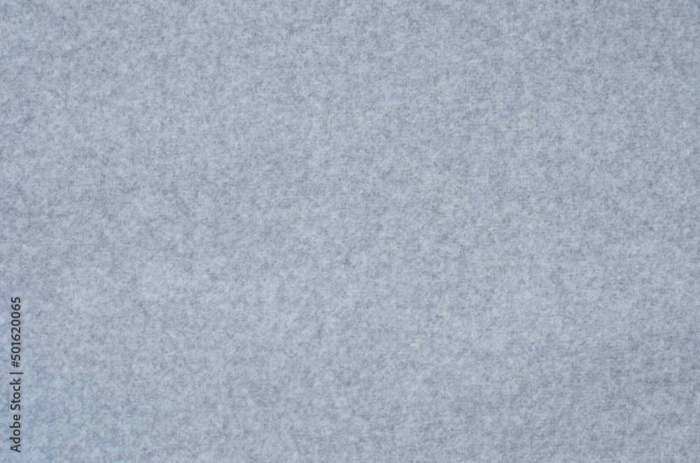 background. non-uniform surface of fabric of light gray color. Fine pile material. background. non-uniform surface of fabric of light gray color. Fine pile material.