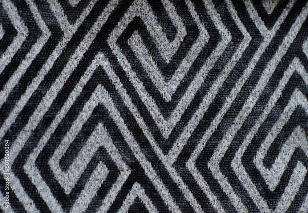 abstract geometric pattern on fabric, black lines and rhombuses on gray background. abstract geometric pattern on fabric, black lines and rhombuses on gray background.