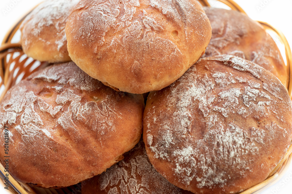 Homemade, fresh round-shaped buns with a crispy brown crust. Close-up. Background.