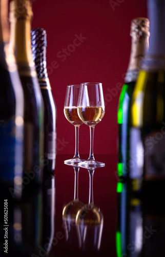 Two glasses of sparkling wine for coffee bottles.beautiful photo of alcohol