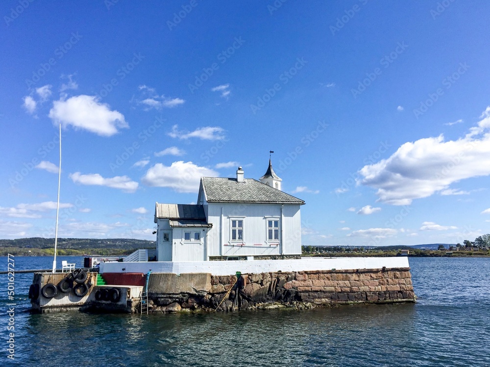 Former lighthouse in Oslo fjord. Norway. Former lighthouse on small island in the middle of Oslofjord. Recently unique restaurant Dyna Fyr