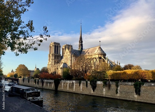 Notre Dame de Paris cathedral view from Pont de l’Archeveche over Seine river. Notre Dame de Paris view before fire. Autumn in Paris, sunny day.