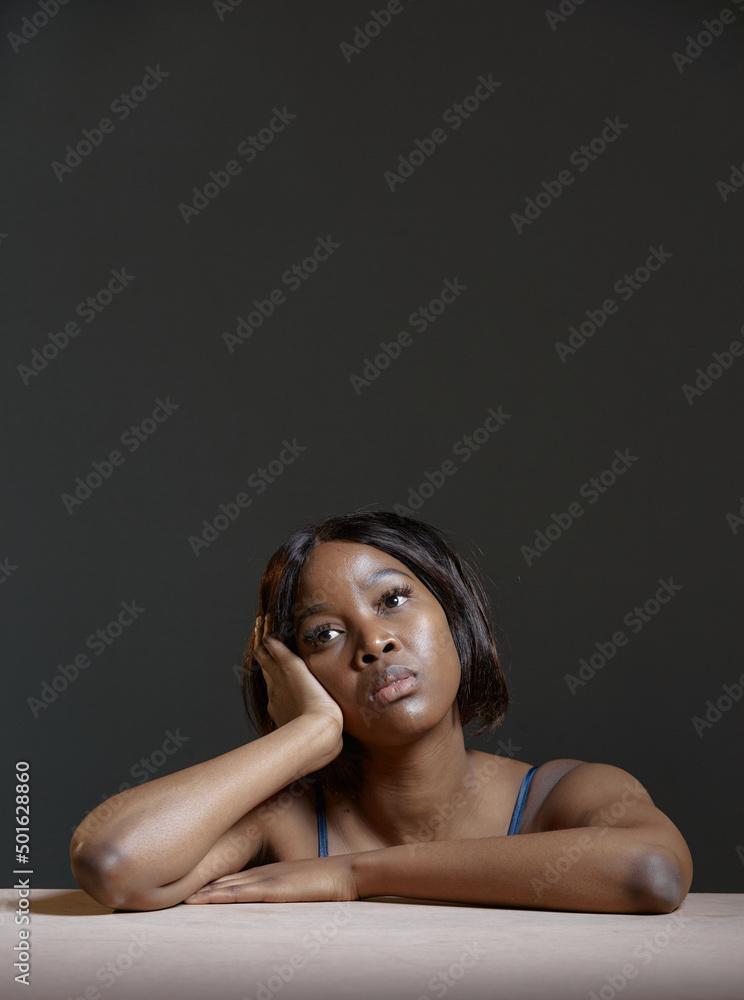 Pensive frustrated alone african american young woman feel sad, deciding problem, holds head. Studio portrait, copyspace Pensive frustrated alone african american young woman feel sad, deciding problem, holds head. Studio portrait, copyspace