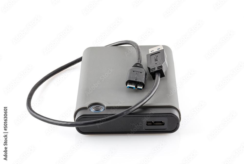 External hard drive disc with usb 3.0 cable, black. Best way of data  storage on portable hdd. Close-up side left view isolated on white  background. Full depth of field. foto de Stock