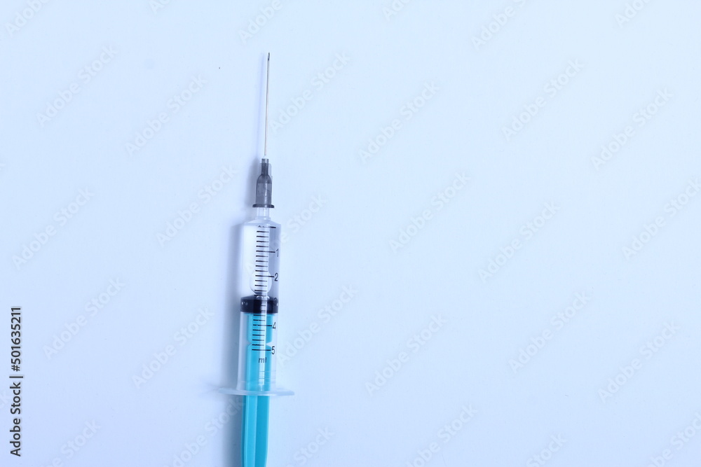 Medical syringe on a white background. A syringe for injection. The concept of health and beauty Medical syringe on a white background. A syringe for injection. The concept of health and beauty