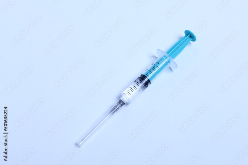 Medical syringe on a white background. A syringe for injection. The concept of health and beauty Medical syringe on a white background. A syringe for injection. The concept of health and beauty
