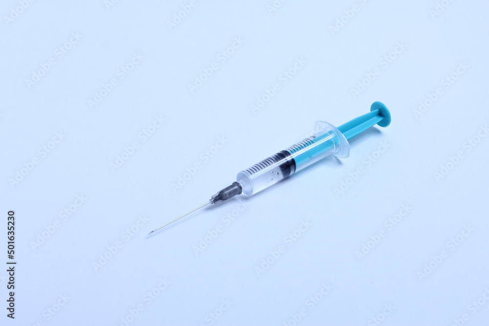 Medical syringe on a white background. A syringe for injection. The concept of health and beauty Medical syringe on a white background. A syringe for injection. The concept of health and beauty