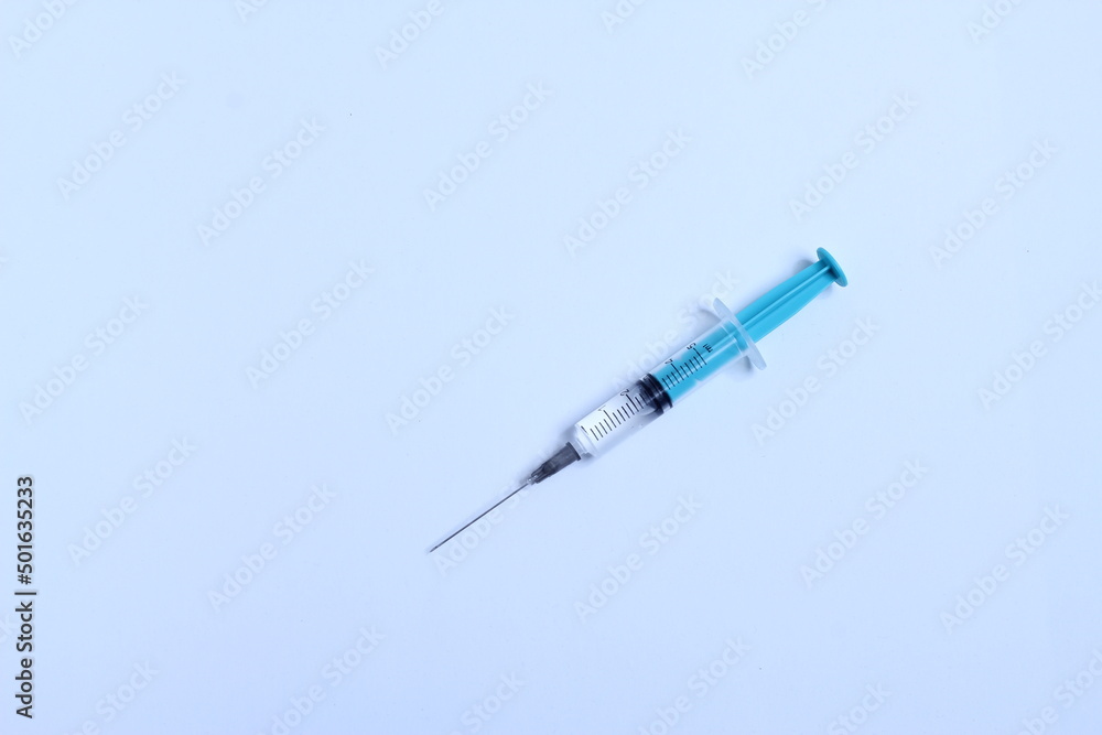 Medical syringe on a white background. A syringe for injection. The concept of health and beauty Medical syringe on a white background. A syringe for injection. The concept of health and beauty