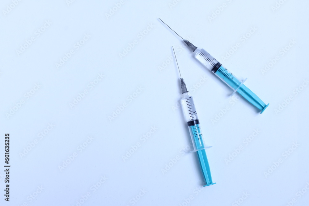 Medical syringe on a white background. A syringe for injection. The concept of health and beauty Medical syringe on a white background. A syringe for injection. The concept of health and beauty