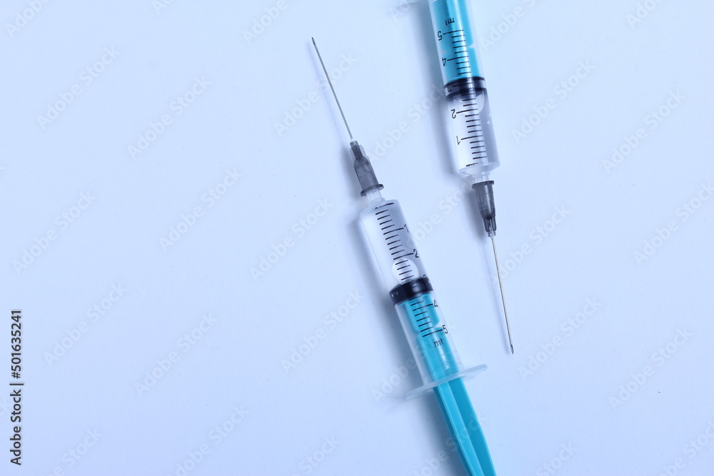 Medical syringe on a white background. A syringe for injection. The concept of health and beauty Medical syringe on a white background. A syringe for injection. The concept of health and beauty