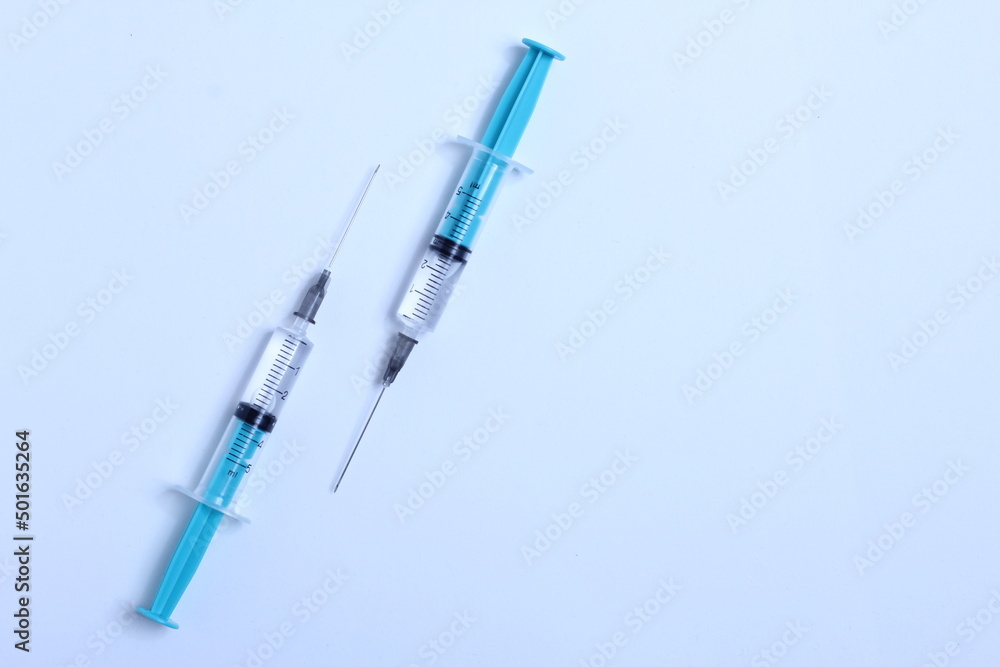 Medical syringe on a white background. A syringe for injection. The concept of health and beauty Medical syringe on a white background. A syringe for injection. The concept of health and beauty
