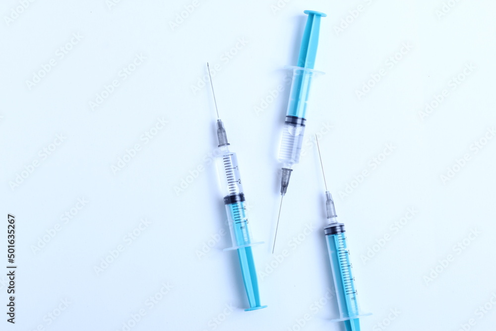 Medical syringe on a white background. A syringe for injection. The concept of health and beauty Medical syringe on a white background. A syringe for injection. The concept of health and beauty