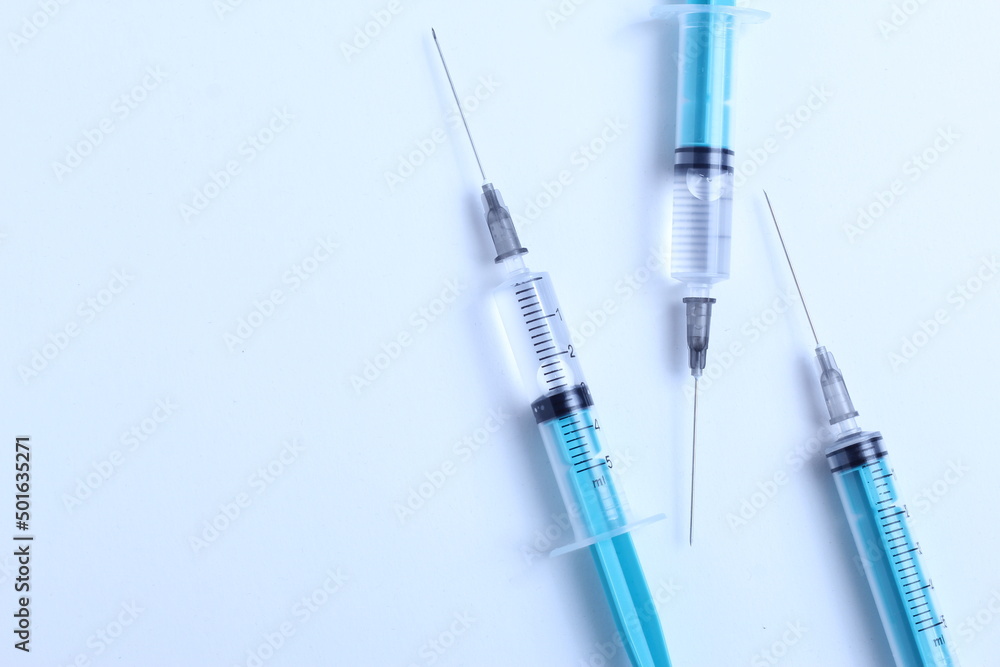 Medical syringe on a white background. A syringe for injection. The concept of health and beauty Medical syringe on a white background. A syringe for injection. The concept of health and beauty