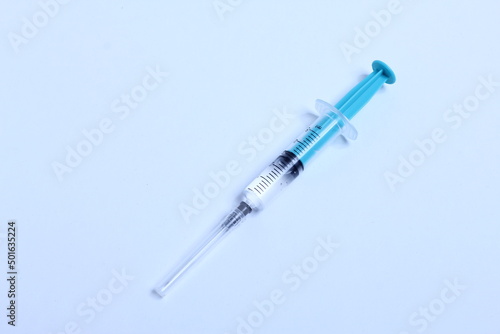 Medical syringe on a white background. A syringe for injection. The concept of health and beauty